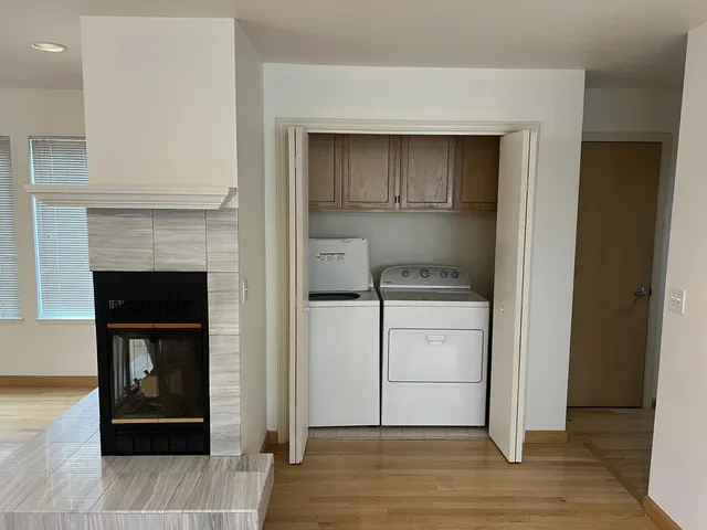 a room with a fireplace and wooden floor