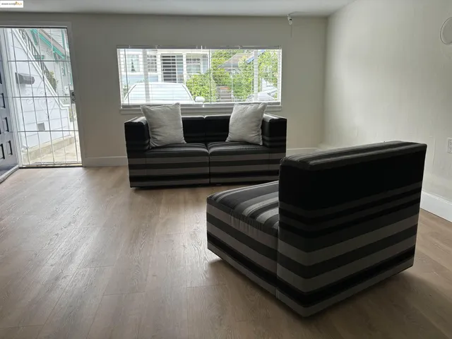 an empty room with a empty space and windows