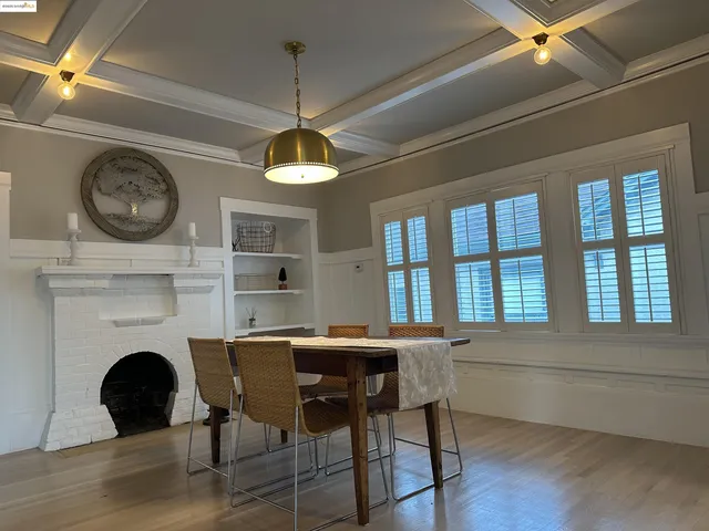 a kitchen with stainless steel appliances granite countertop a sink a stove a refrigerator and cabinets