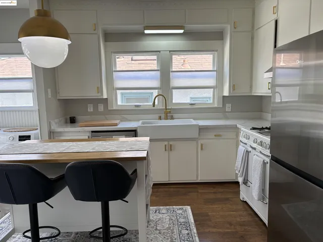 a living room with a table furniture and a chandelier