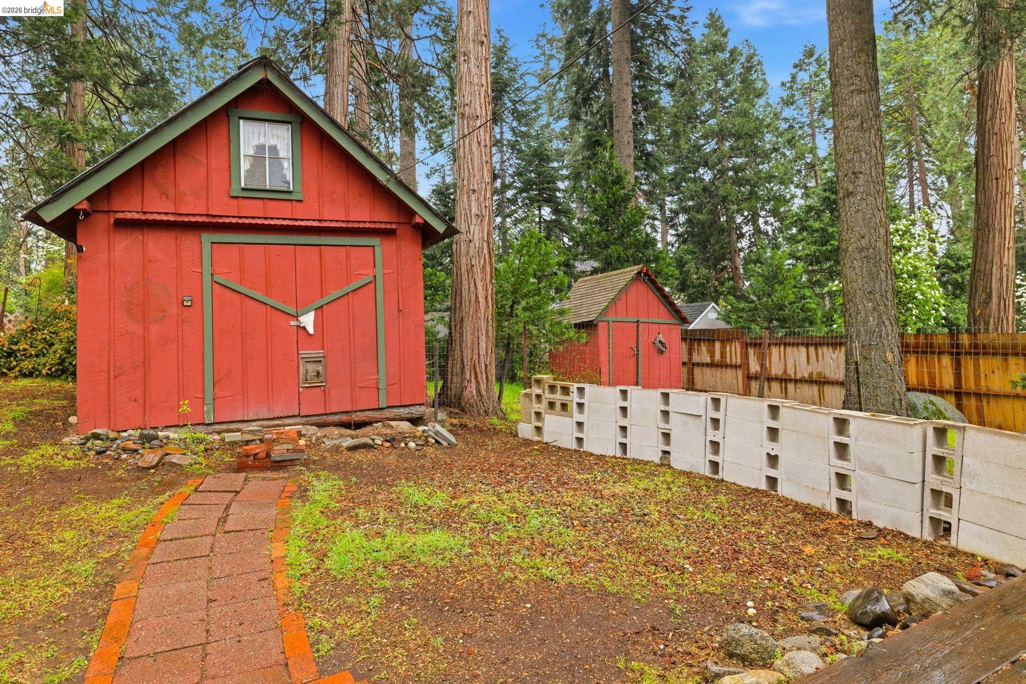 24249 Sugarpine Road Mi Wuk Village, CA 95383 - Photo 17 of 18 a view of a house with wooden fence