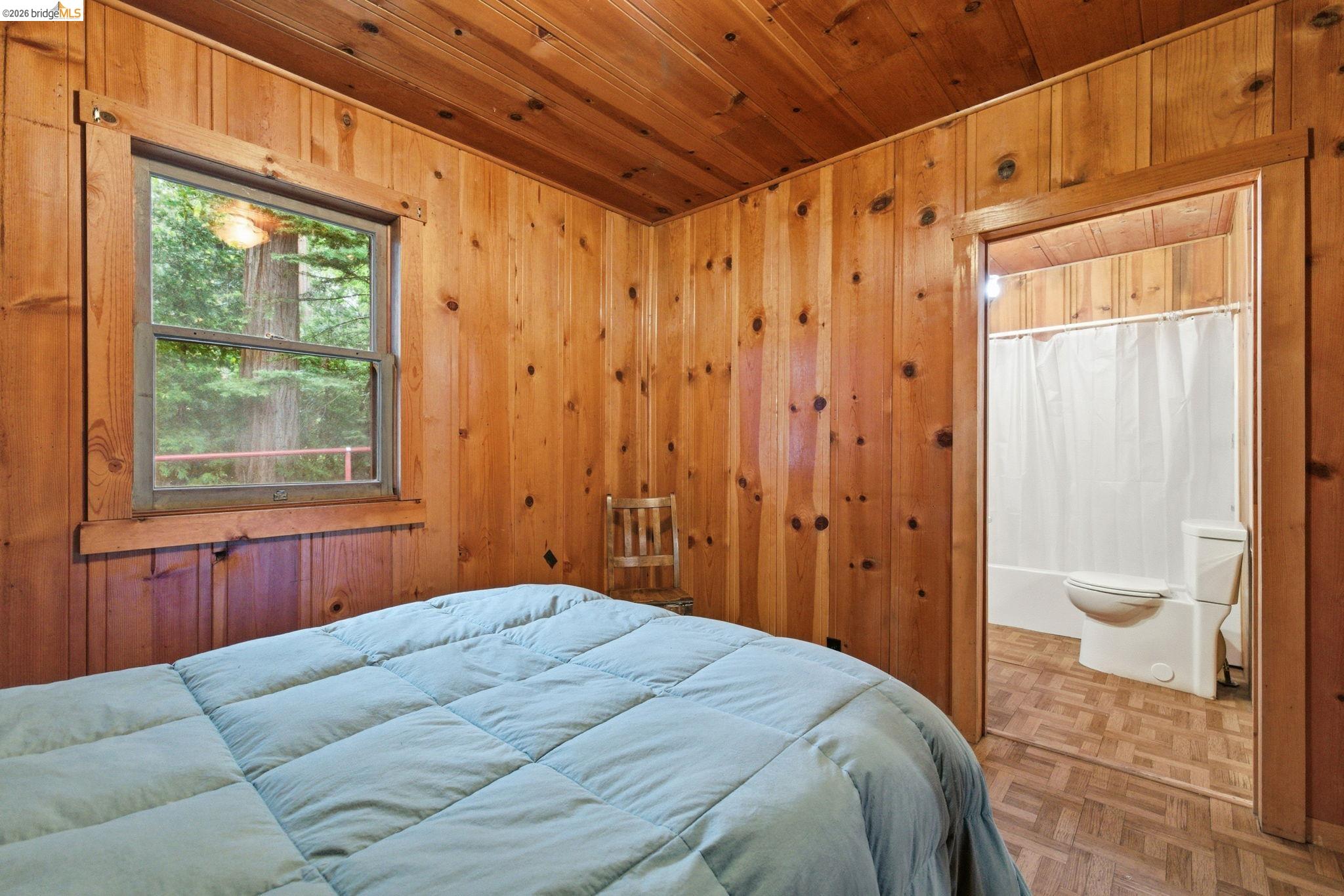 24249 Sugarpine Road Mi Wuk Village, CA 95383 - Photo 6 of 18 a bedroom with a bed and a window