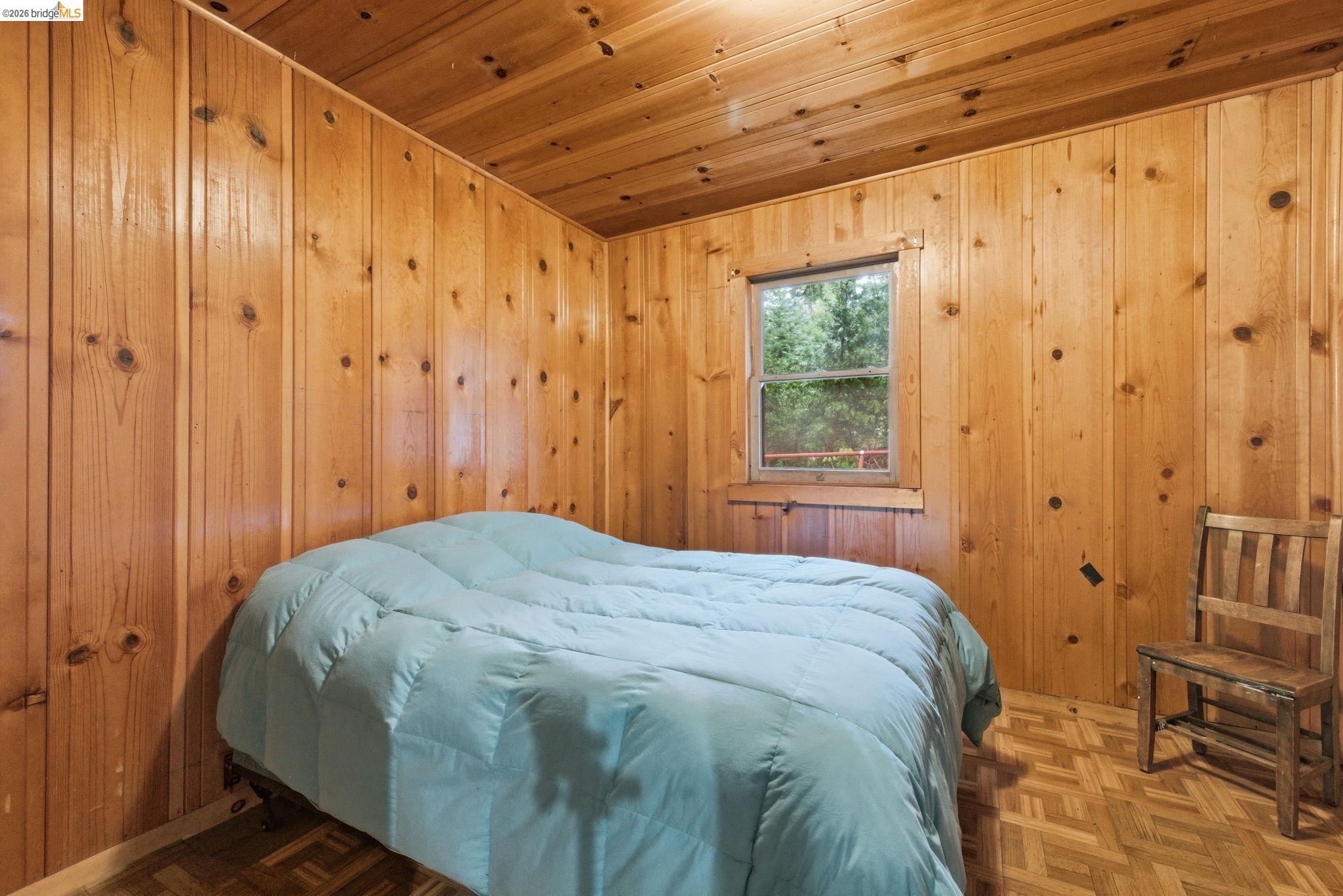 24249 Sugarpine Road Mi Wuk Village, CA 95383 - Photo 7 of 18 a bedroom with a bed and a window