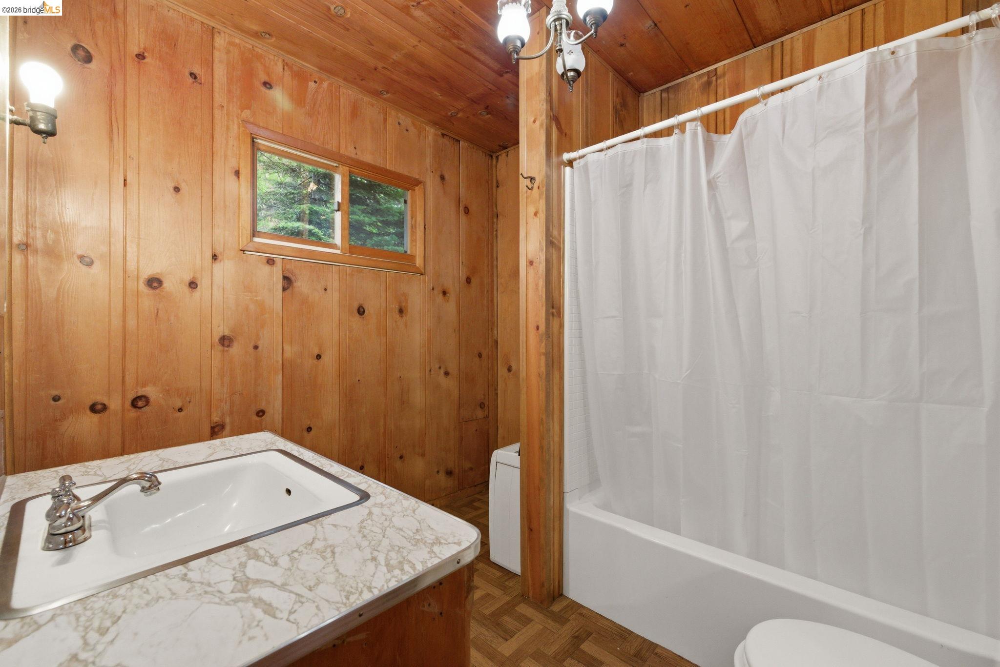 24249 Sugarpine Road Mi Wuk Village, CA 95383 - Photo 8 of 18 a bathroom with a granite countertop sink and a bathtub