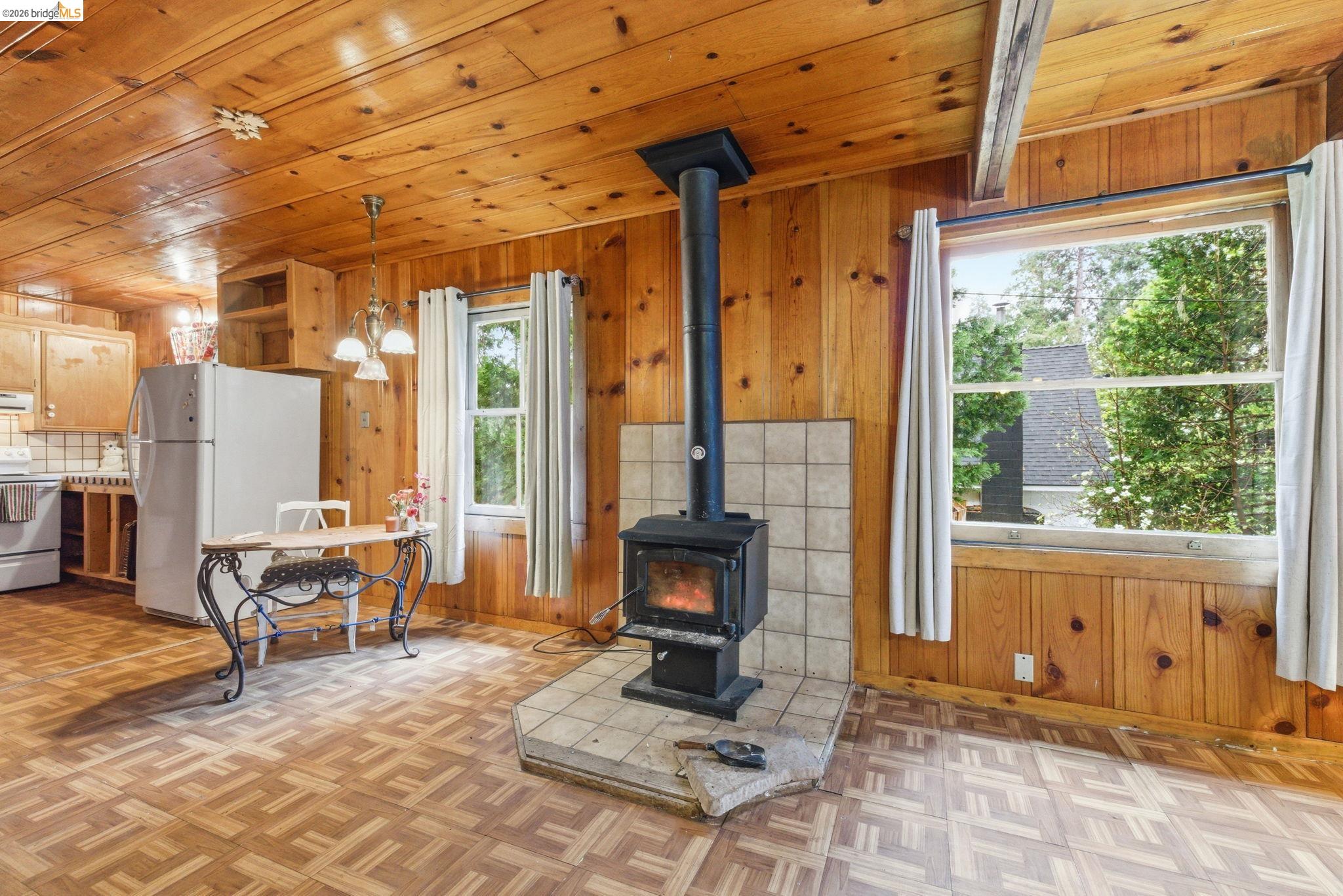 24249 Sugarpine Road Mi Wuk Village, CA 95383 - Photo 9 of 18 a living room with furniture windows and a fireplace