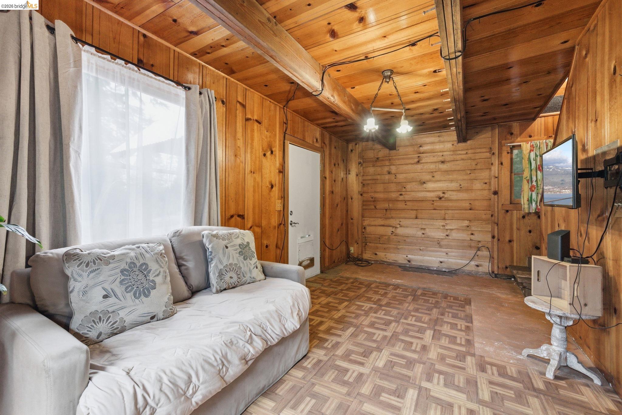 24249 Sugarpine Road Mi Wuk Village, CA 95383 - Photo 10 of 18 a living room with furniture and a fireplace
