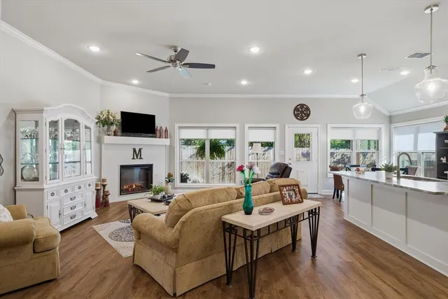 a living room with furniture fireplace and flat screen tv