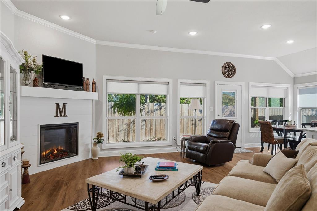 10059 Dayspring Drive Flint, TX 75762 - Photo 14 of 37 a living room with furniture a fireplace and a flat screen tv