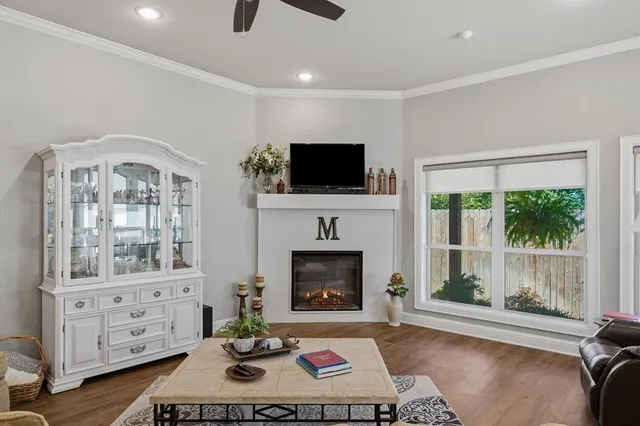 a living room with furniture fireplace and flat screen tv