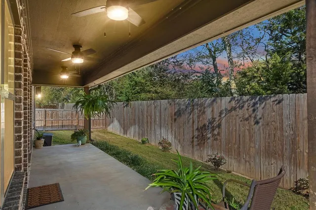 a backyard of a house with a garden and plants