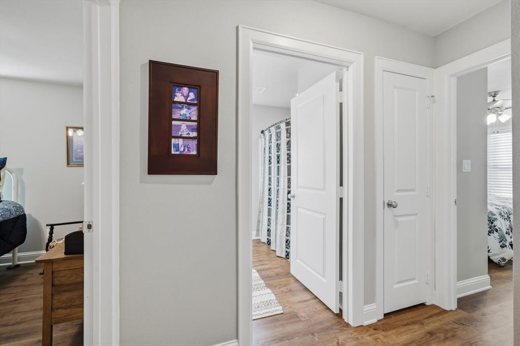 10059 Dayspring Drive Flint, TX 75762 - Photo 23 of 37 a view of a hallway with wooden floor and closet
