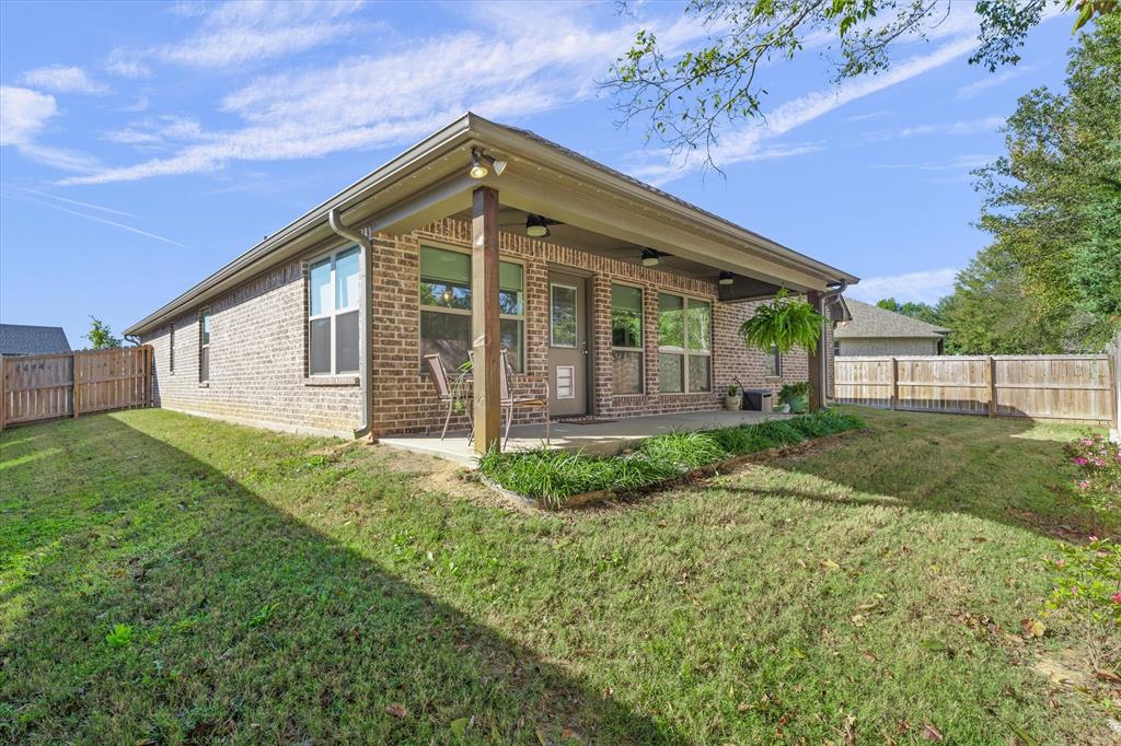 10059 Dayspring Drive Flint, TX 75762 - Photo 33 of 37 a front view of a house with garden