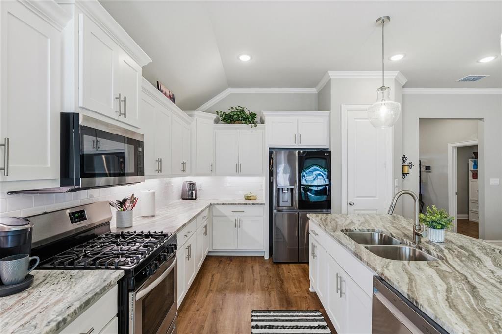 10059 Dayspring Drive Flint, TX 75762 - Photo 9 of 37 a kitchen with granite countertop a stove and a sink