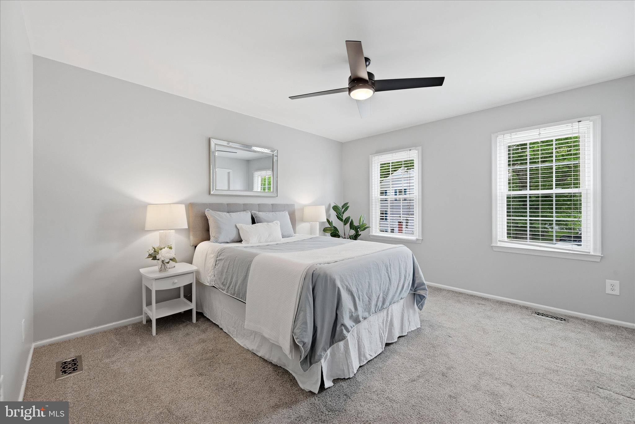 5446 Lighthouse Lane Burke, VA 22015 - Photo 13 of 36 a spacious bedroom with a bed and a window