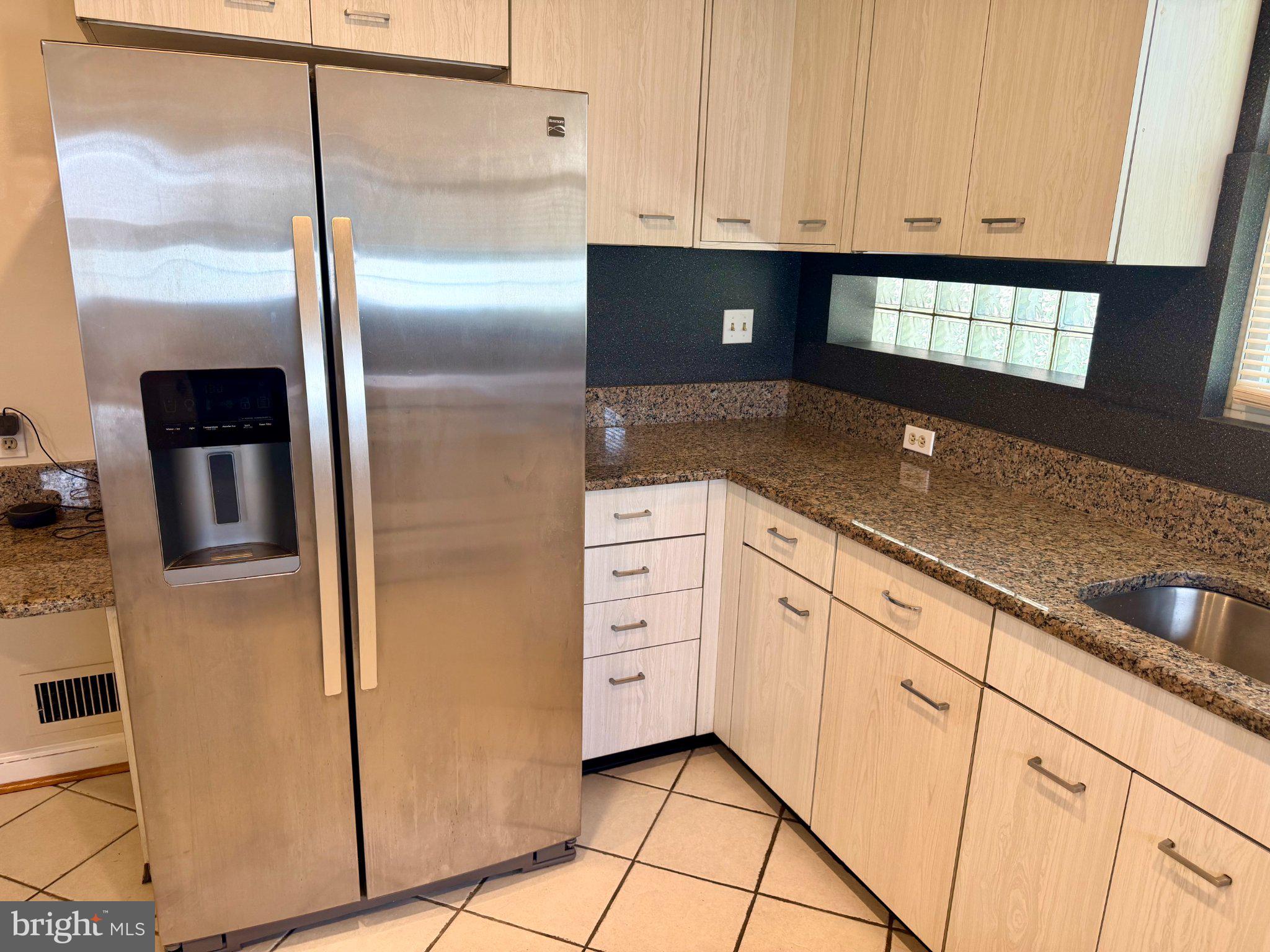 6318 Winner Avenue Baltimore, MD 21215 - Photo 24 of 75 a kitchen with granite countertop white cabinets and white appliances