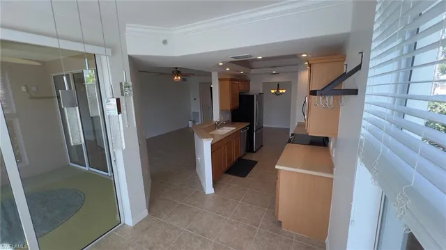 a view of a kitchen with electric appliances