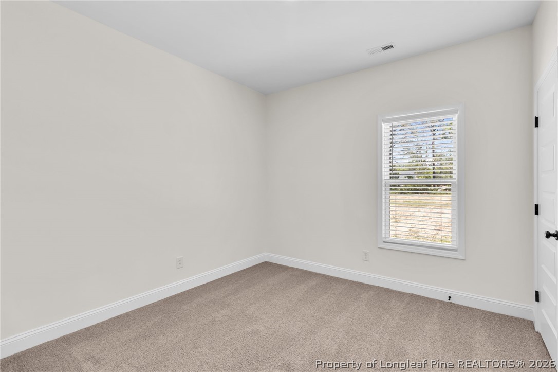 131 Merle Road Pinebluff, NC 28373 - Photo 24 of 33 an empty room with a window