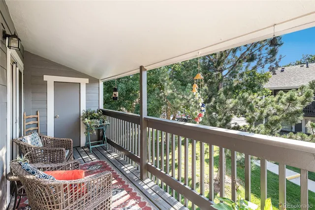 a view of balcony with furniture