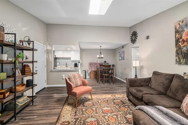 a living room with furniture and a rug