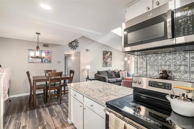 a kitchen with a stove and cabinets