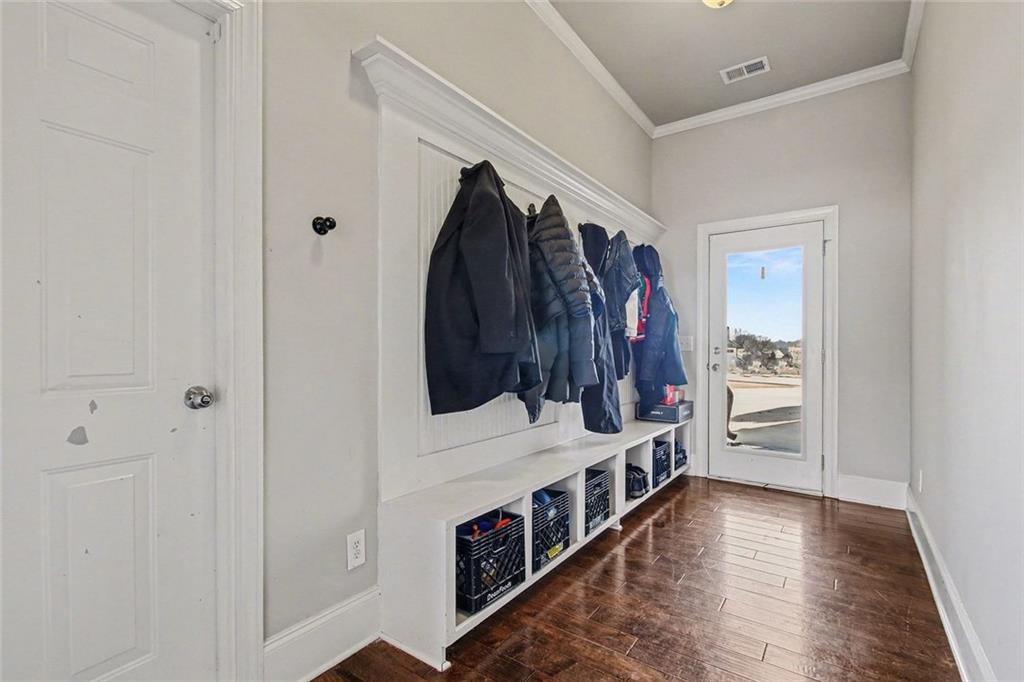 971 Traditions Way Jefferson, GA 30549 - Photo 21 of 53 a view of hallway with a window and wooden floor