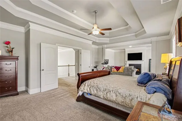 a bedroom with double bed and a chandelier