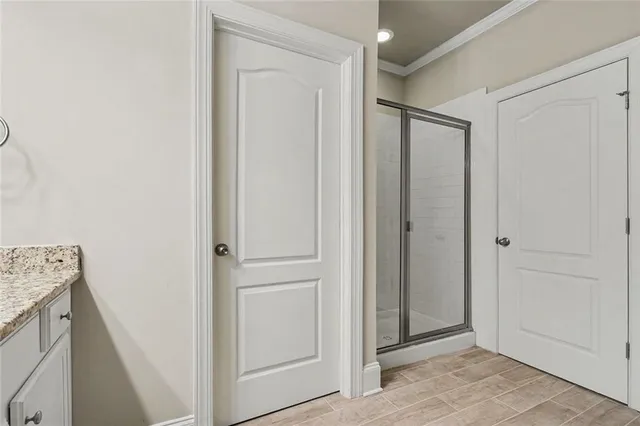 a bedroom with furniture and wooden floor