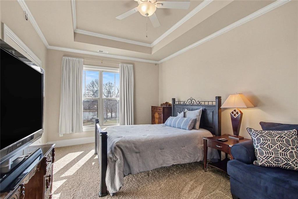 971 Traditions Way Jefferson, GA 30549 - Photo 39 of 53 a bedroom with bed and a flat tv screen on dresser