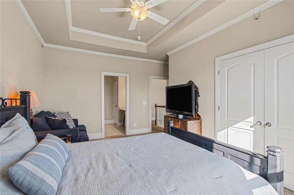 971 Traditions Way Jefferson, GA 30549 - Photo 40 of 53 a bedroom with bed and a flat tv screen on dresser