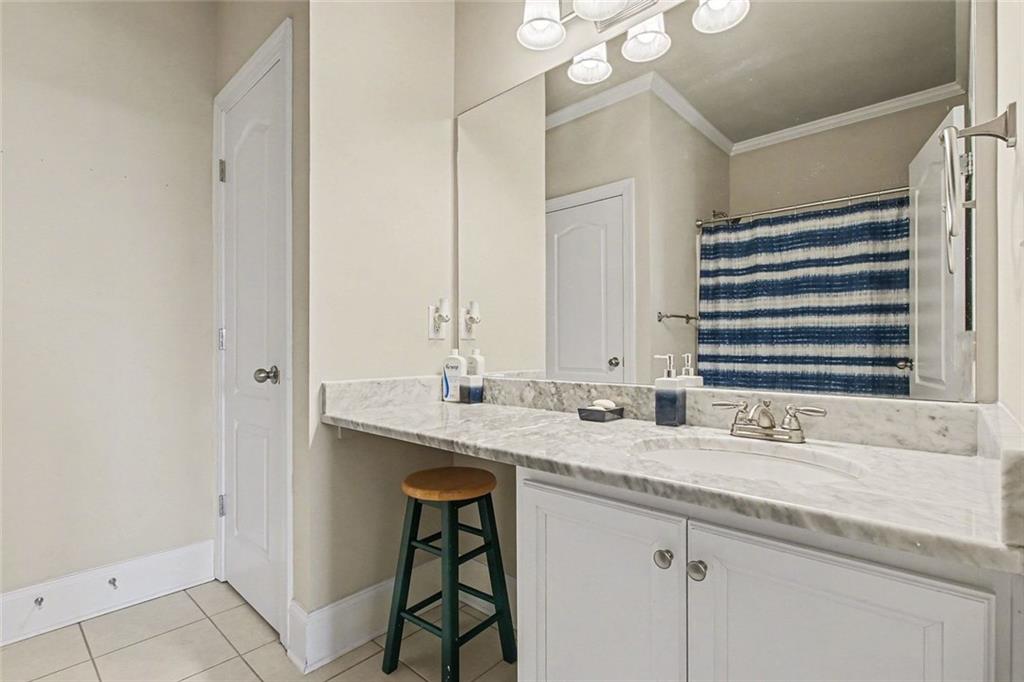 971 Traditions Way Jefferson, GA 30549 - Photo 41 of 53 a bathroom with a granite countertop sink and a mirror
