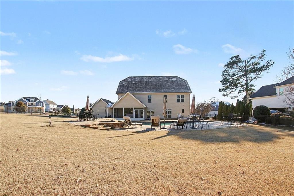 971 Traditions Way Jefferson, GA 30549 - Photo 46 of 53 a swimming pool with outdoor seating and yard