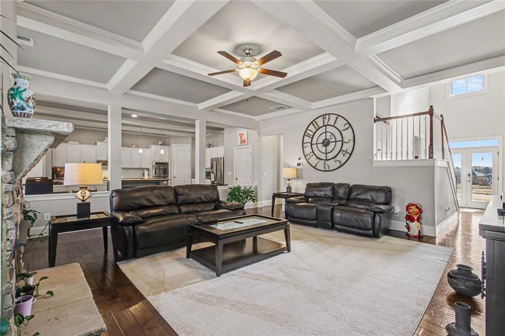 971 Traditions Way Jefferson, GA 30549 - Photo 7 of 53 a living room with furniture a clock on wall and a clock