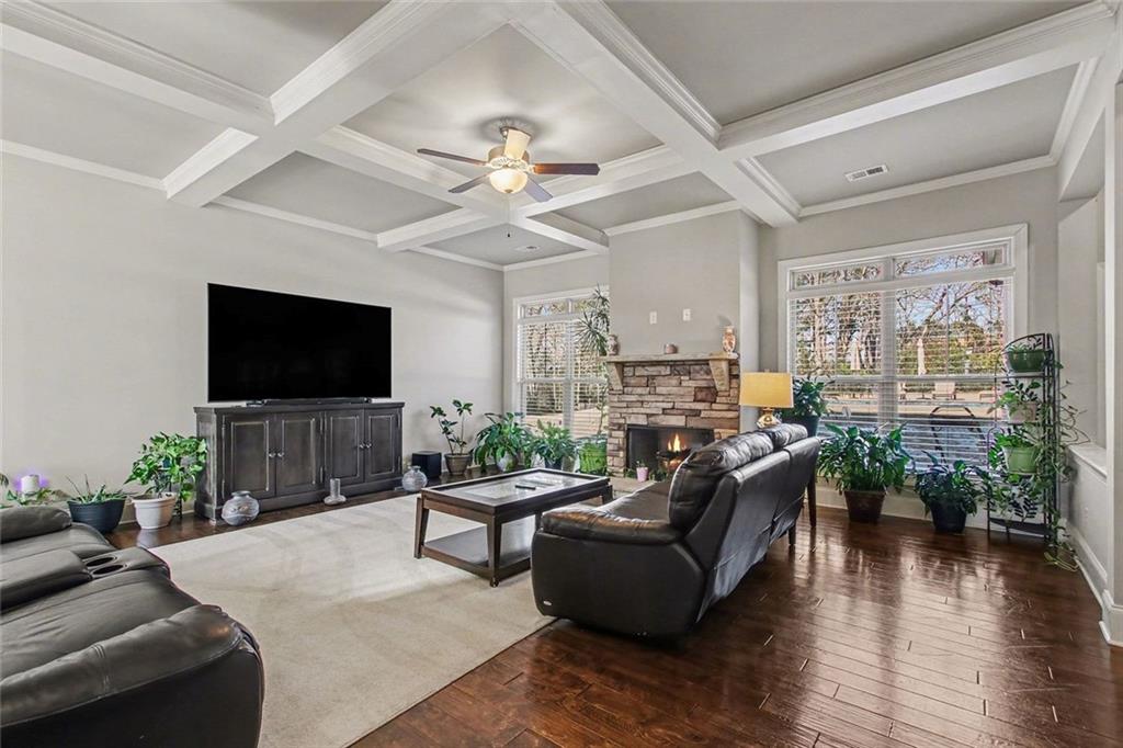 971 Traditions Way Jefferson, GA 30549 - Photo 8 of 53 a living room with furniture and a flat screen tv