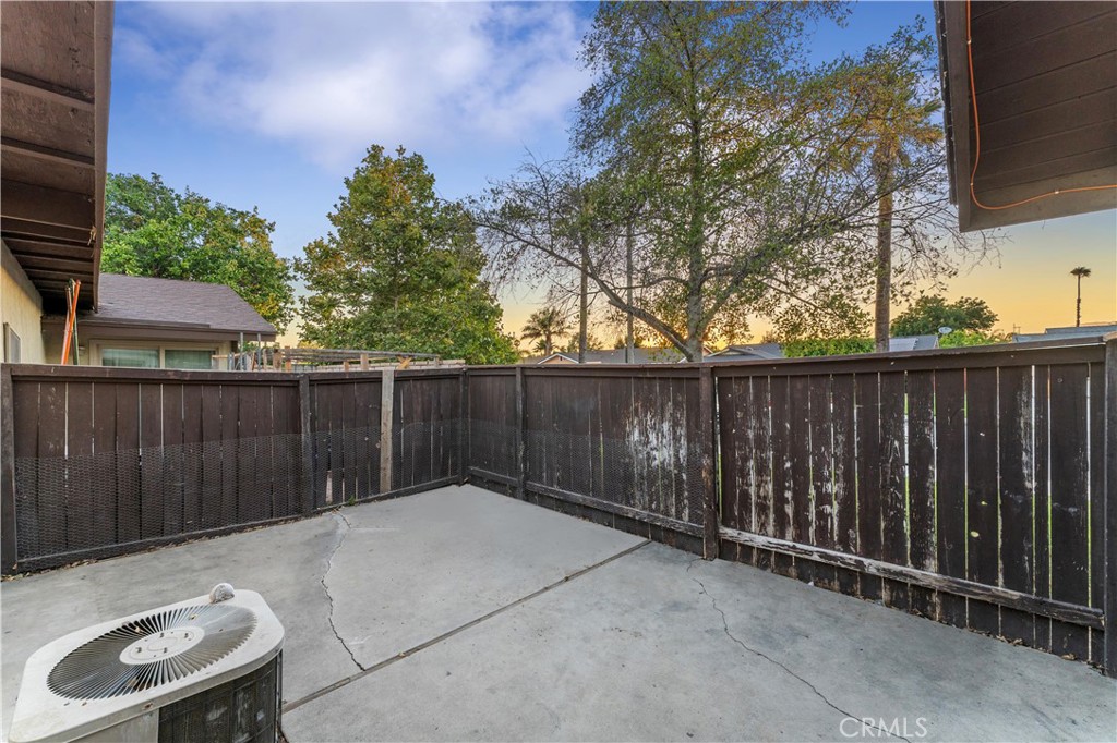 9154 Delano Drive Riverside, CA 92503 - Photo 6 of 20 a backyard of a house with wooden fence