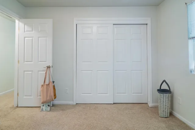 a view of empty room with white walls
