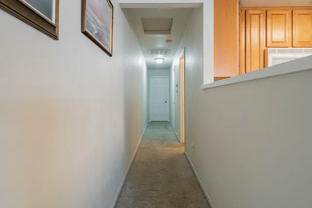 a bathroom with a toilet and a shower curtain