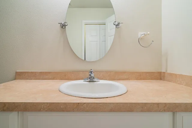 a view of a pathway both side of house