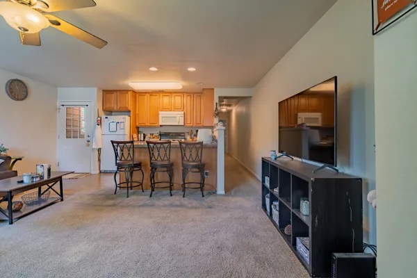 a view of a livingroom with furniture and a flat screen tv