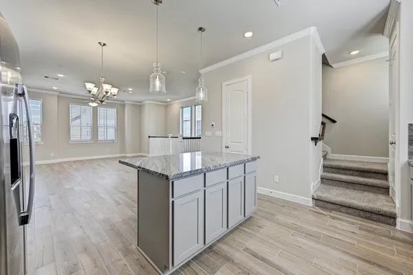a bathroom with a sink a vanity a mirror and shower