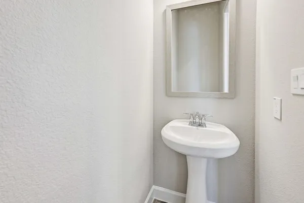 a bathroom with a sink and mirror