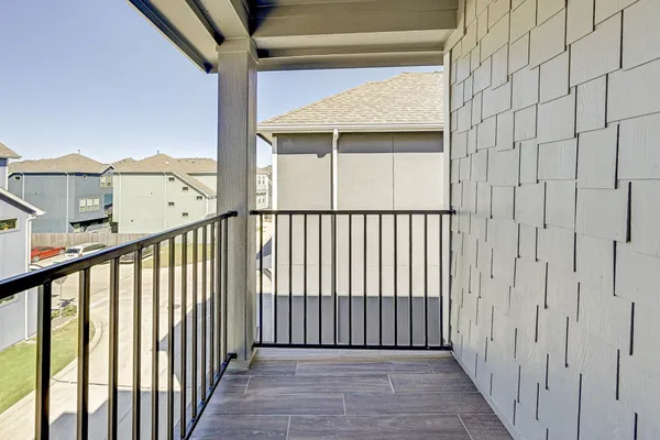 a view of a balcony with wooden floor