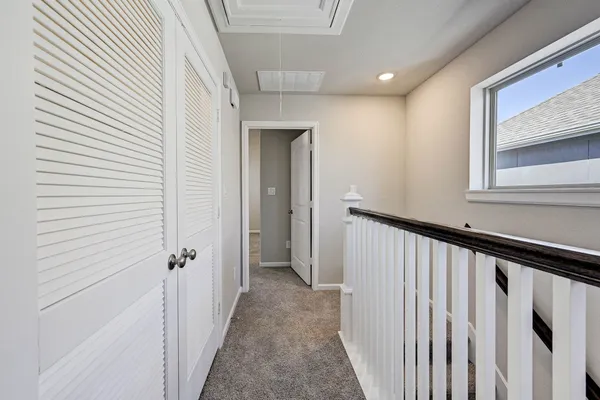 a view of a hallway with a white door