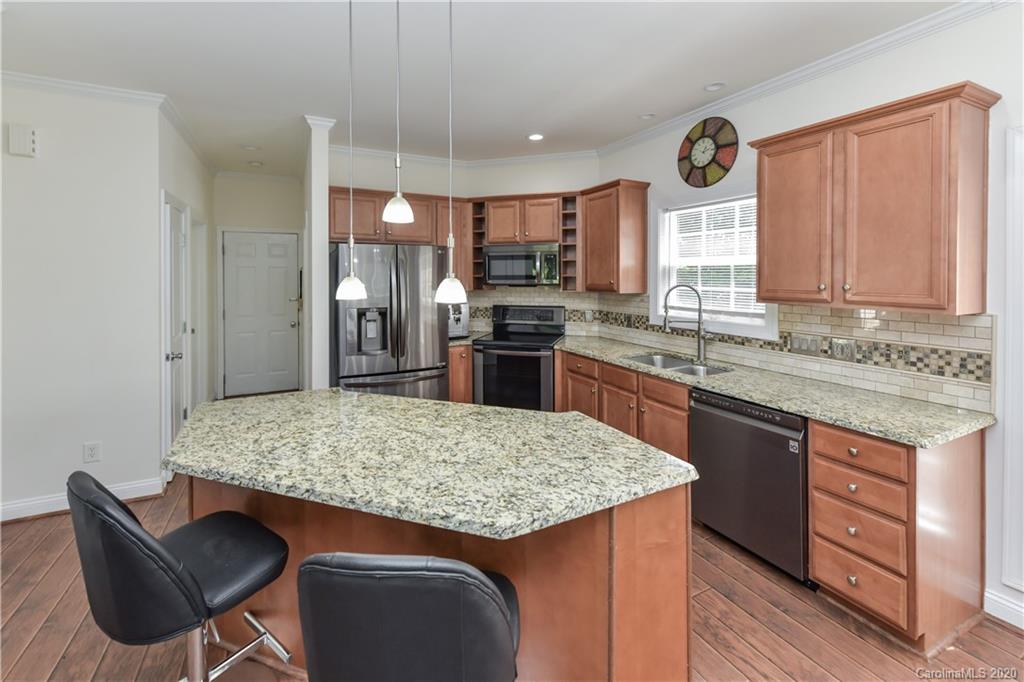 2425 Lakeview Circle Matthews, NC 28105 - Photo 12 of 33 a kitchen with stainless steel appliances granite countertop a stove top oven a sink dishwasher and granite countertops with cabinets