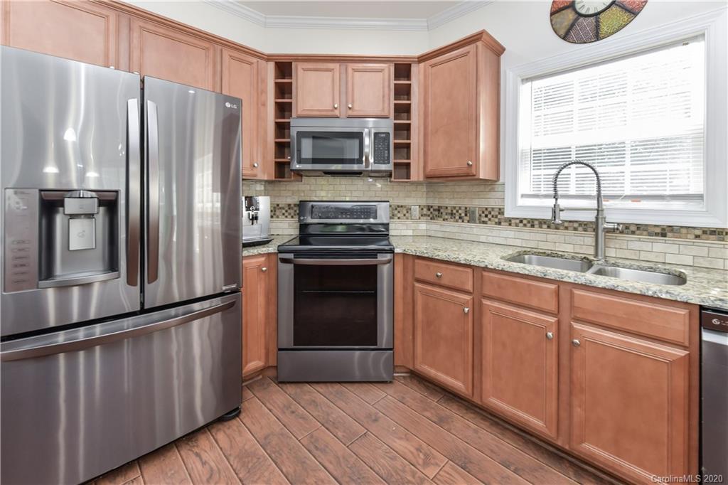 2425 Lakeview Circle Matthews, NC 28105 - Photo 16 of 33 a kitchen with stainless steel appliances granite countertop a refrigerator stove and sink