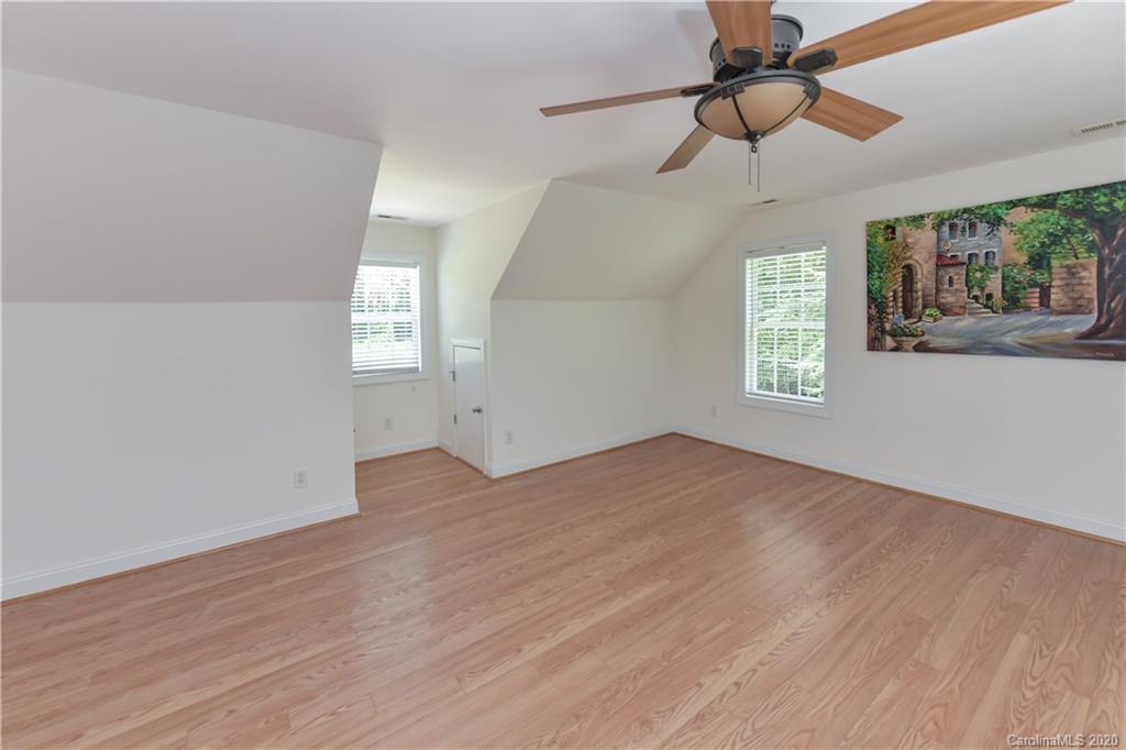 2425 Lakeview Circle Matthews, NC 28105 - Photo 20 of 33 wooden floor in an empty room with a window