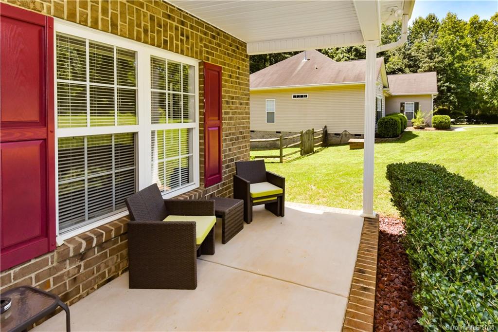 2425 Lakeview Circle Matthews, NC 28105 - Photo 3 of 33 a building outdoor space with patio furniture and a patio