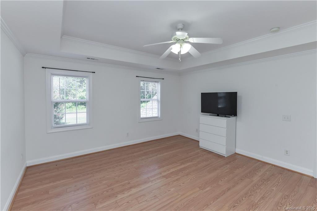 2425 Lakeview Circle Matthews, NC 28105 - Photo 21 of 33 a view of an empty room with a window and wooden floor