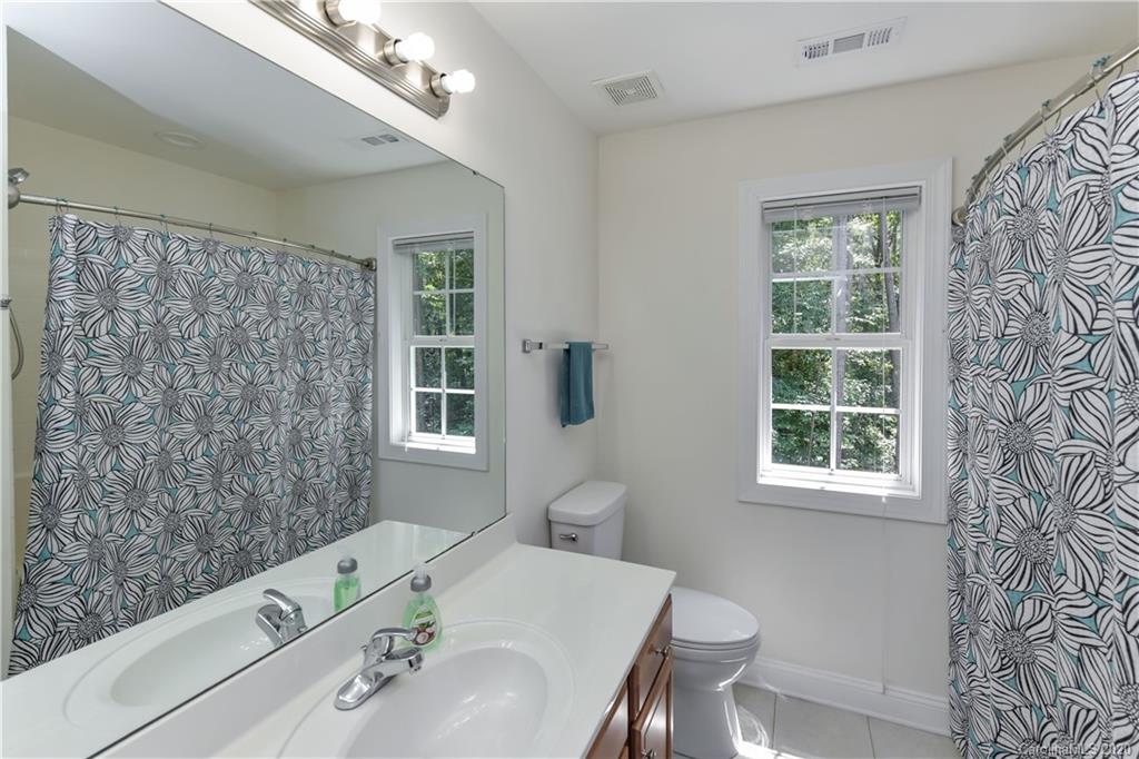 2425 Lakeview Circle Matthews, NC 28105 - Photo 24 of 33 a bath room with a sink and a toilet