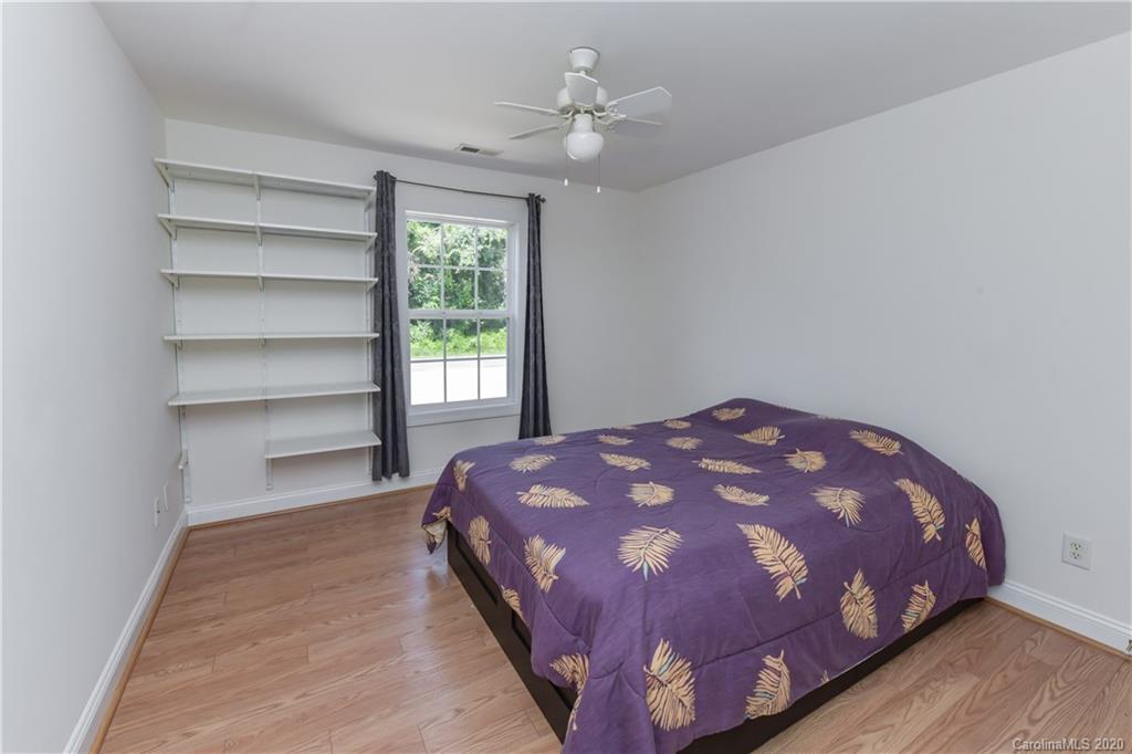 2425 Lakeview Circle Matthews, NC 28105 - Photo 27 of 33 a bedroom with a bed and a window