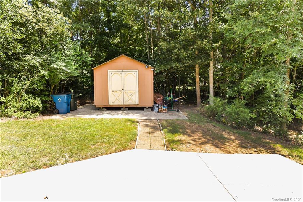 2425 Lakeview Circle Matthews, NC 28105 - Photo 28 of 33 a view of swimming pool with a yard